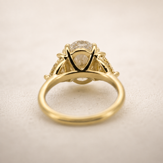 A - 3 ct Oval Cut Ring with Fancy Yellow Trillion Cut Diamonds